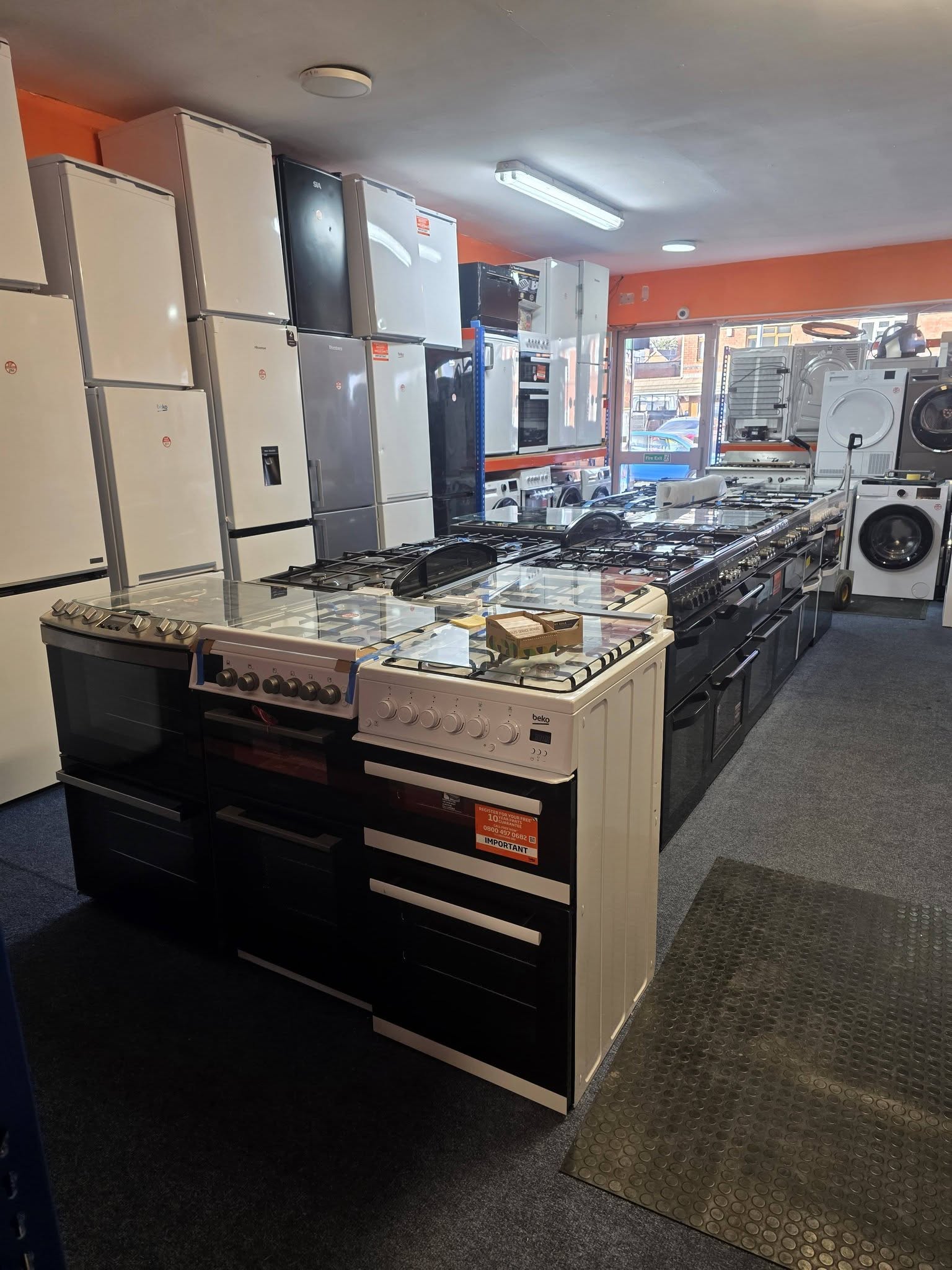Wide view of showroom with cookers and fridges